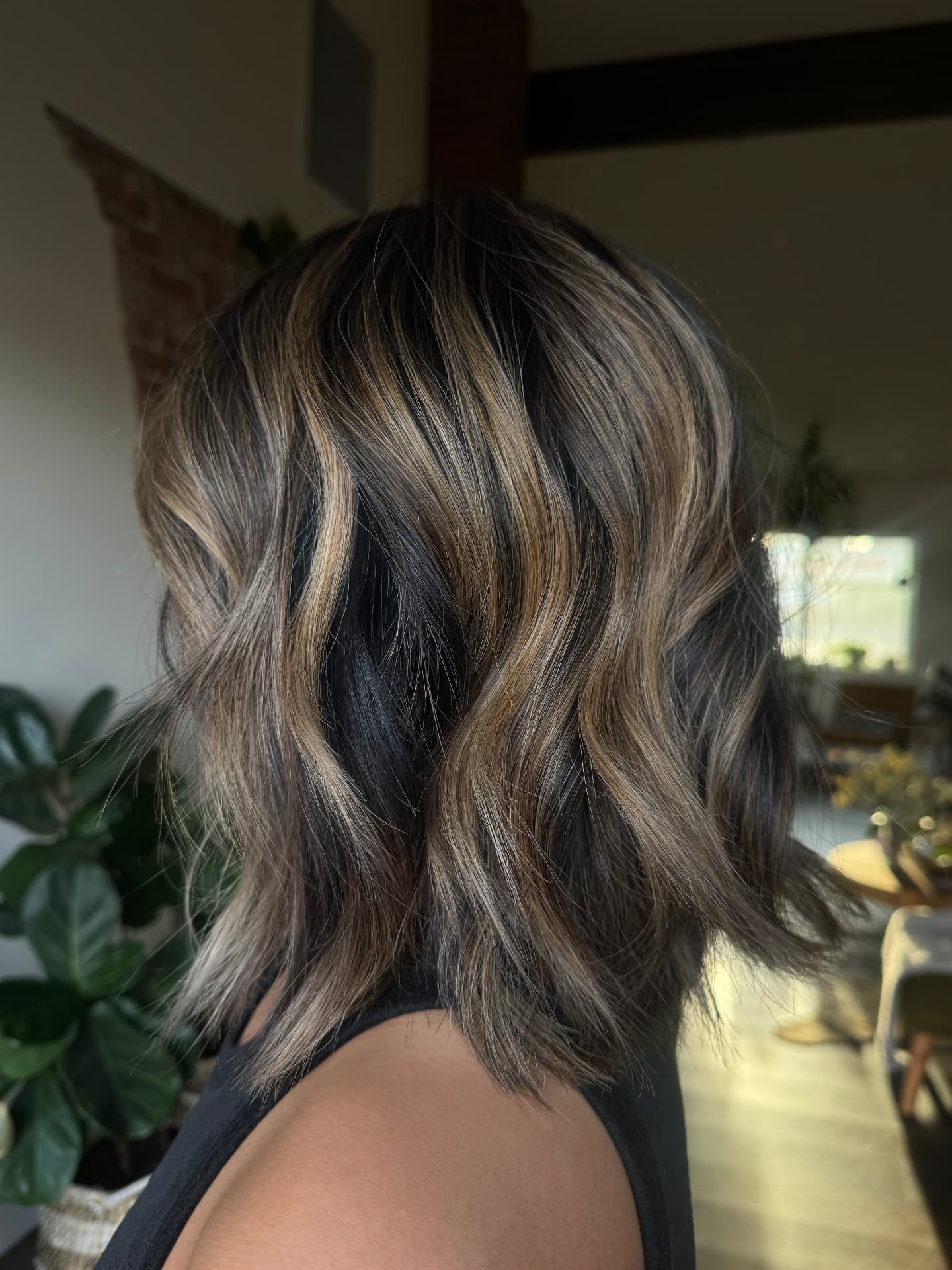 Dimensional brunette bob styled at Casa