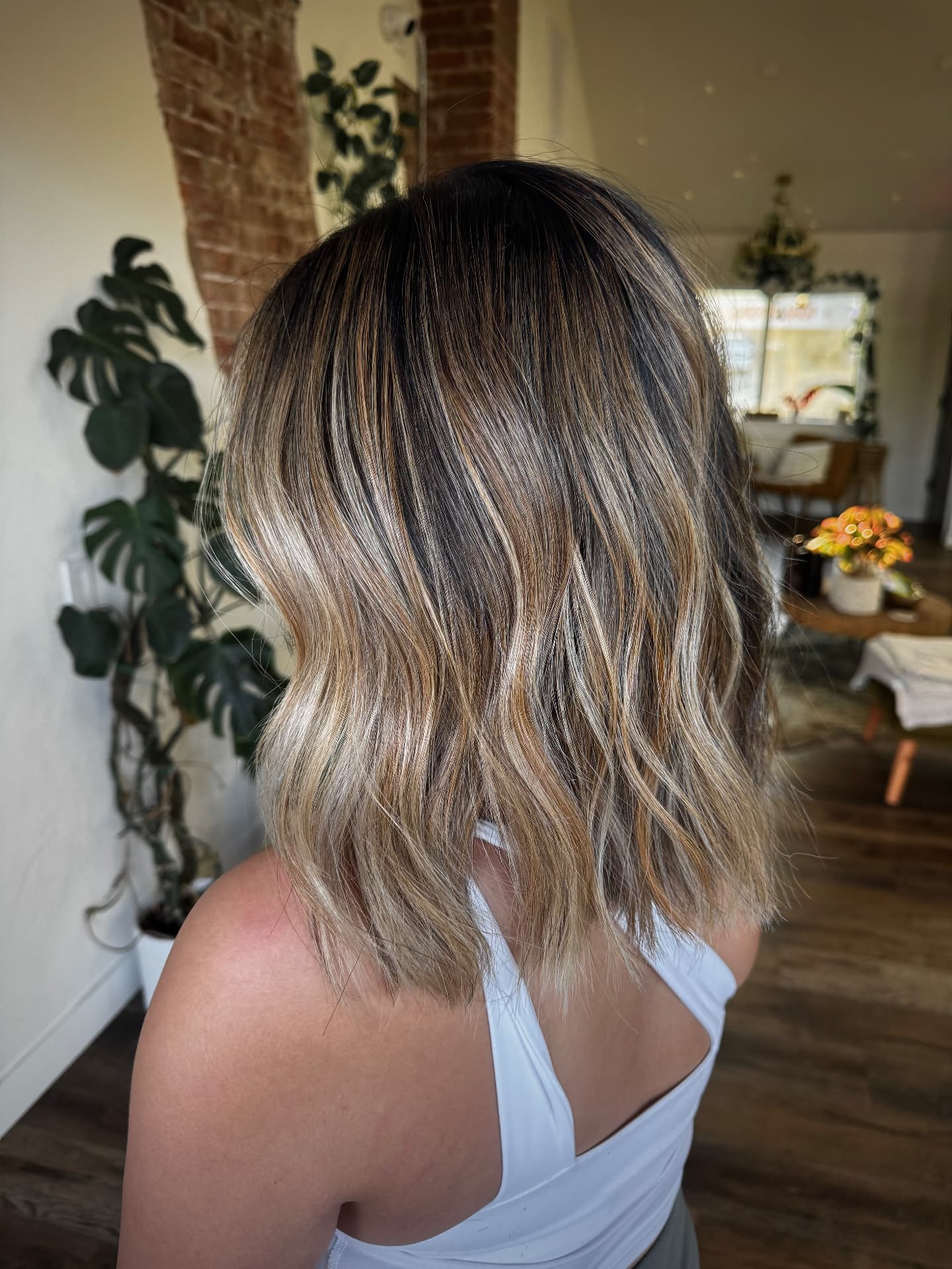 Dimensional blonde bob styled at Casa