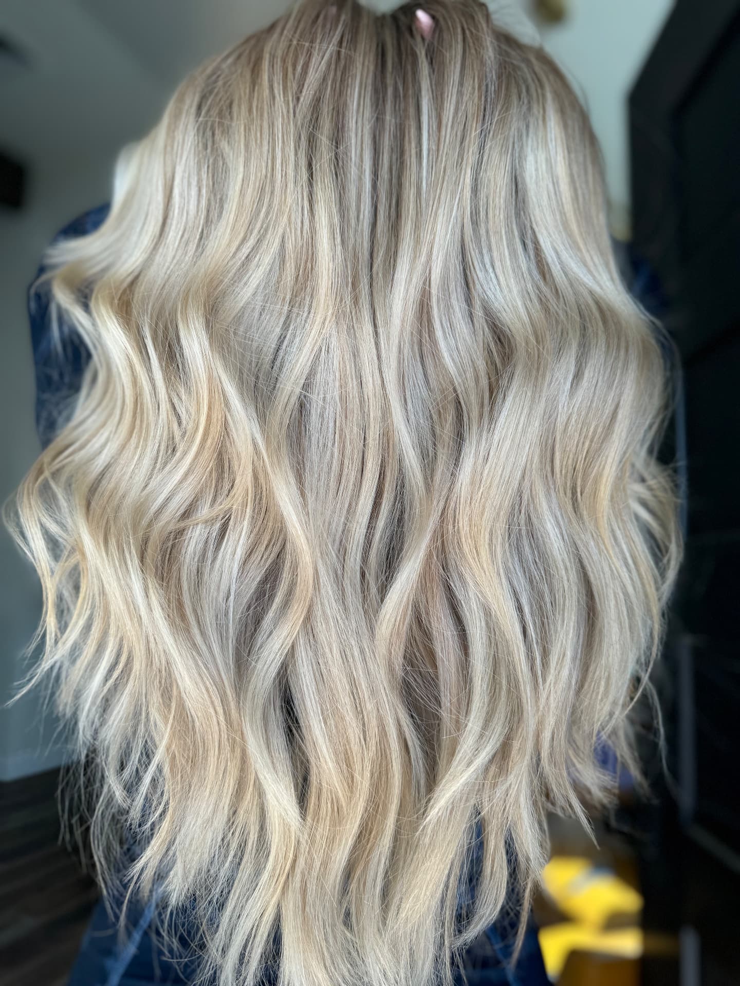 Long platinum and ash blonde hair styled at Casa